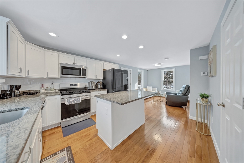 30 Fuller Street Seekonk, MA 02771 - Photo 9 of 42 a view of living room kitchen with stainless steel appliances granite countertop lots of counter top space