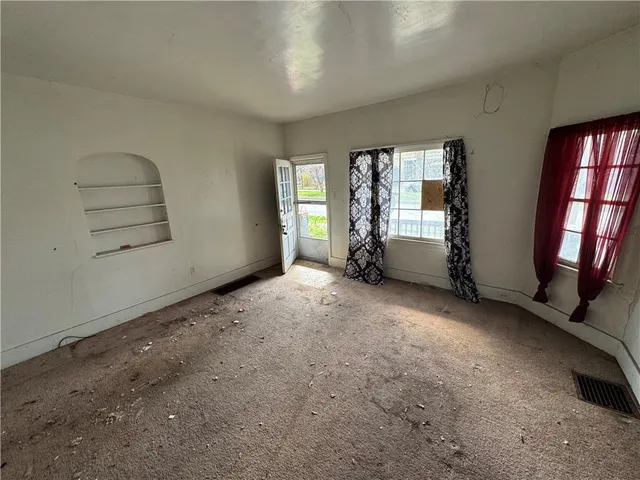 an empty room with windows