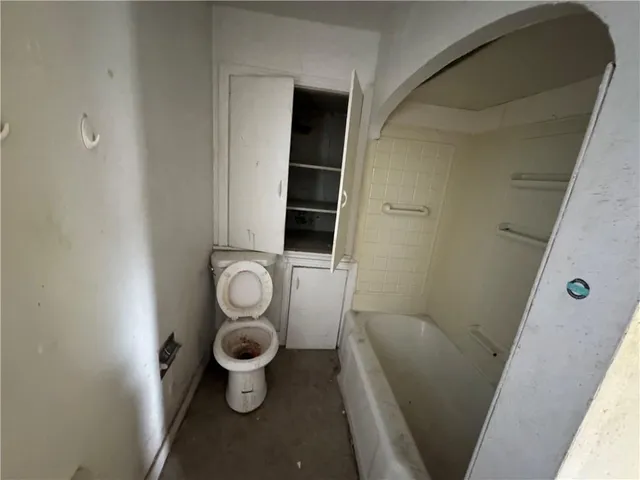 a bathroom with a toilet and a sink