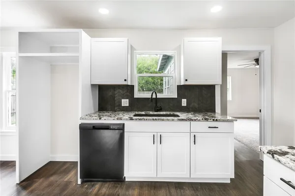 a kitchen with a stove and a microwave