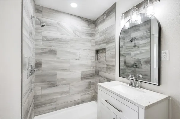 a bathroom with a sink and a mirror