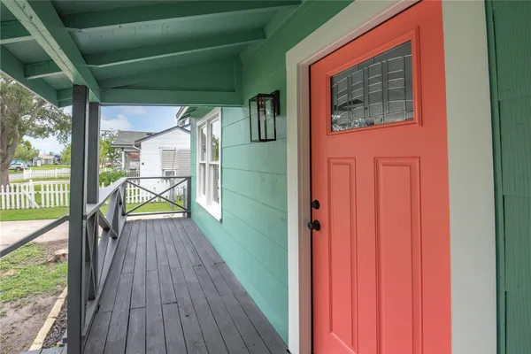 a view of a balcony with wooden floor