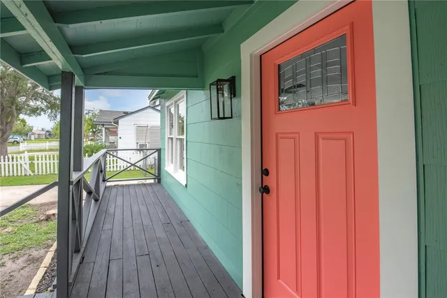 a view of a balcony with wooden floor
