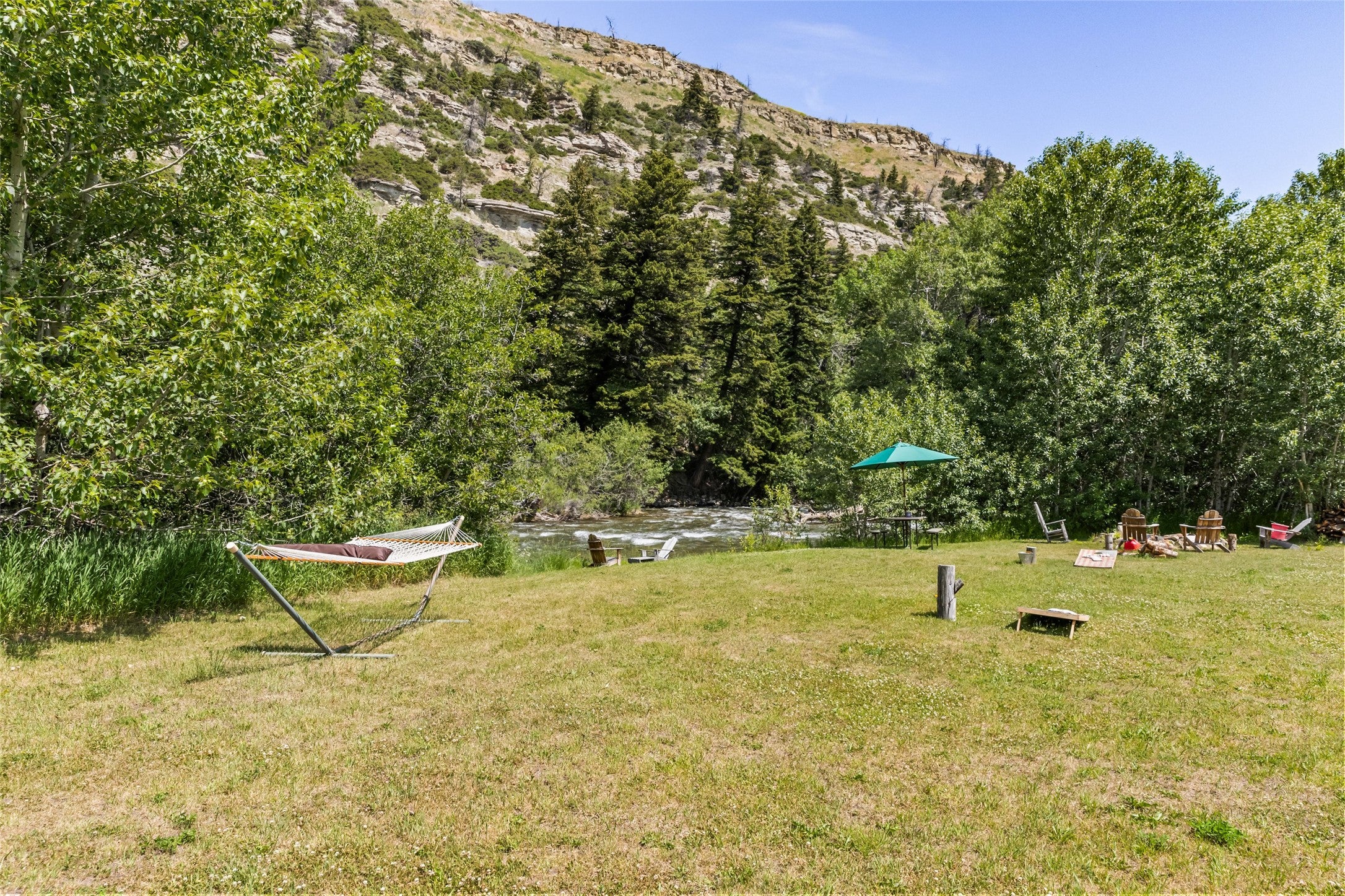 380 West Boulder Road McLeod, MT 59052 - Photo 57 of 77 View of grassy yard featuring a mountain view