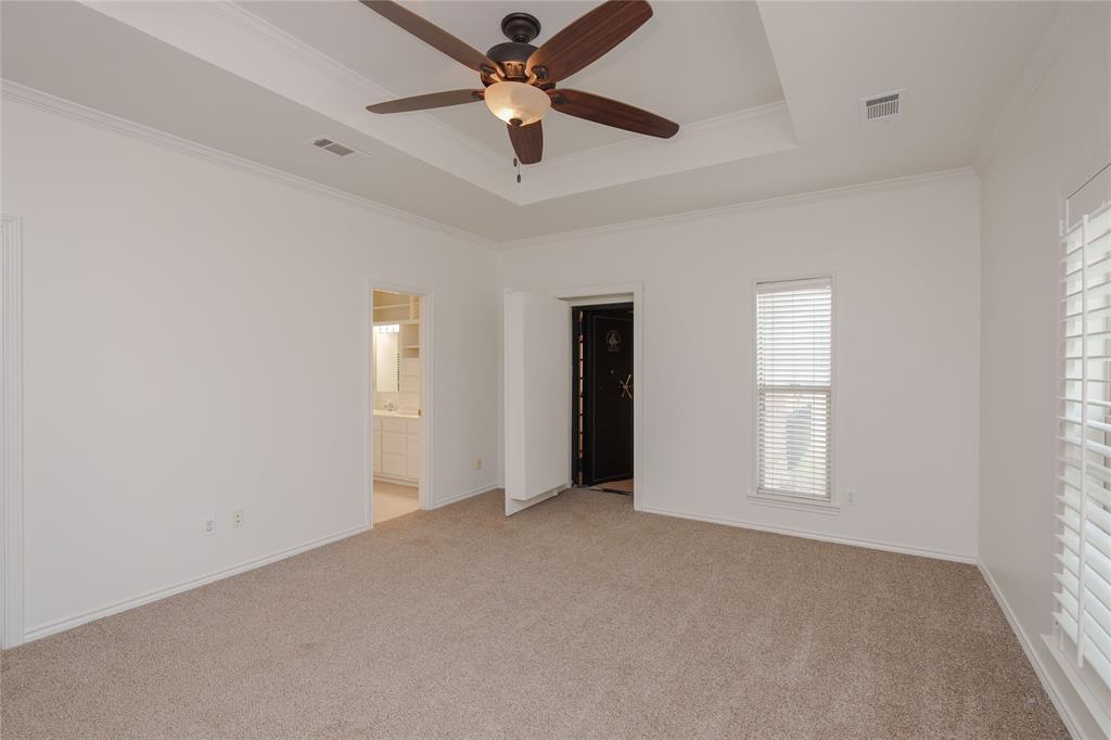 364 Parker Road, Unit A Van Alstyne, TX 75495 - Photo 20 of 39 Spacious room featuring a tray ceiling, ceiling fan with integrated lighting, carpeted flooring, and white window blinds