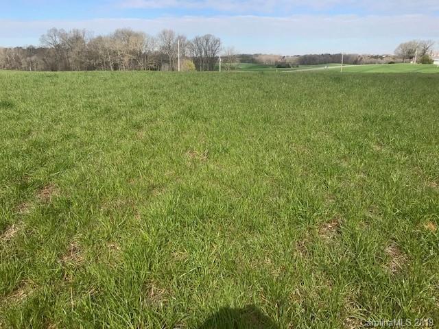 1221 A McIntyre Road Wingate, NC 28174 - Photo 24 of 25 a view of a field with an trees