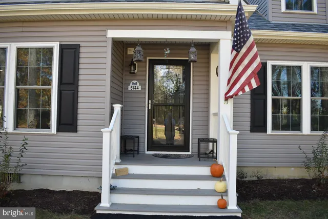 a front view of a house with a porch