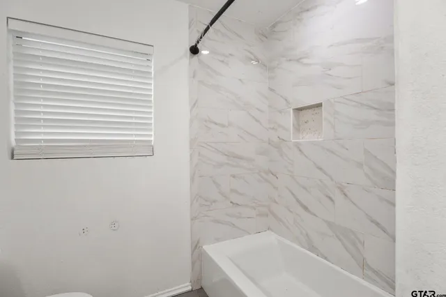a bathroom with a bathtub