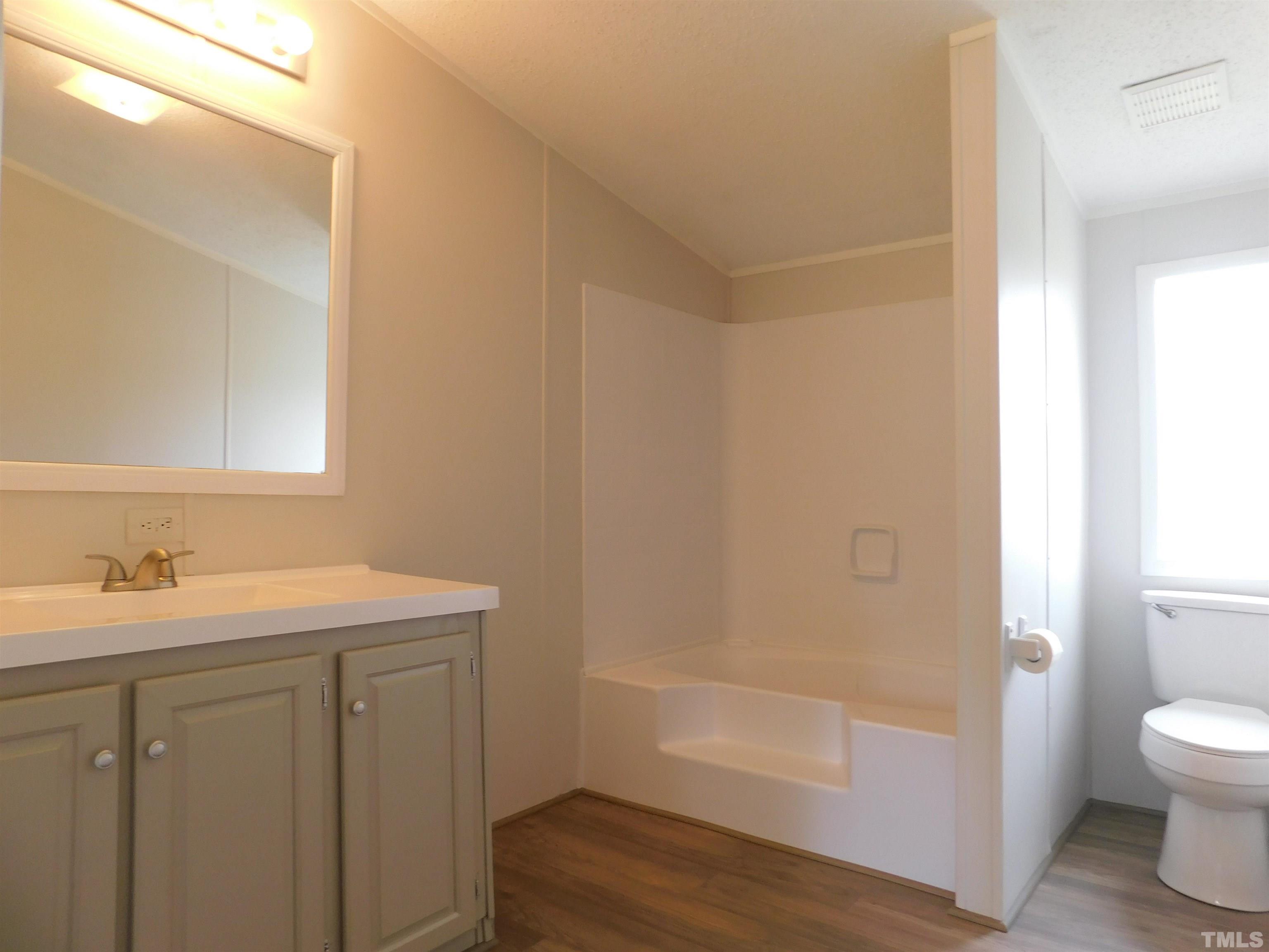 1022 Whitley Road Middlesex, NC 27557 - Photo 11 of 13 a bathroom with a sink a toilet and shower