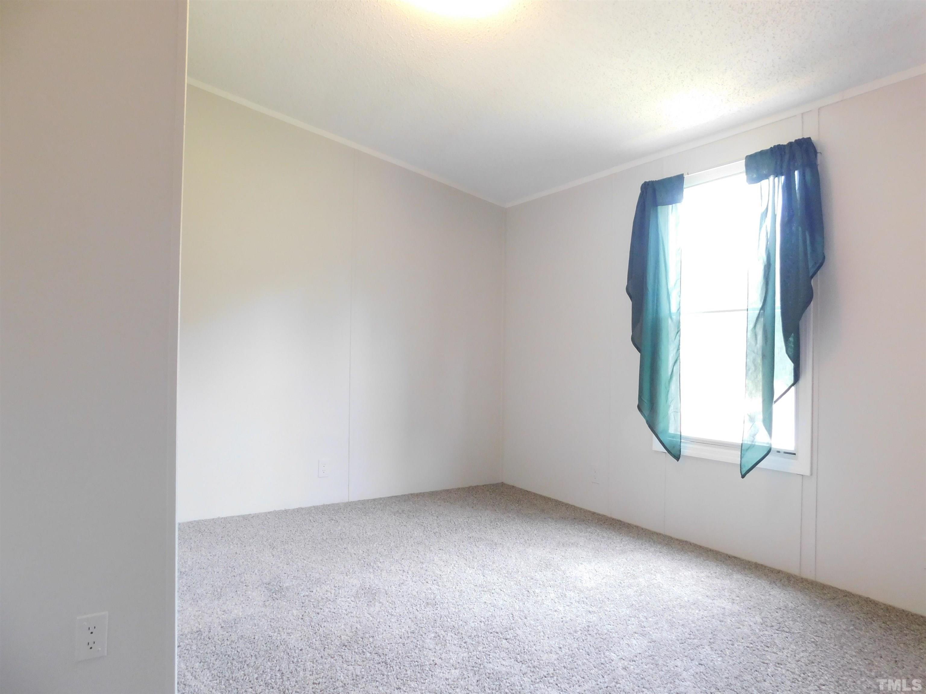 1022 Whitley Road Middlesex, NC 27557 - Photo 9 of 13 an empty room with windows