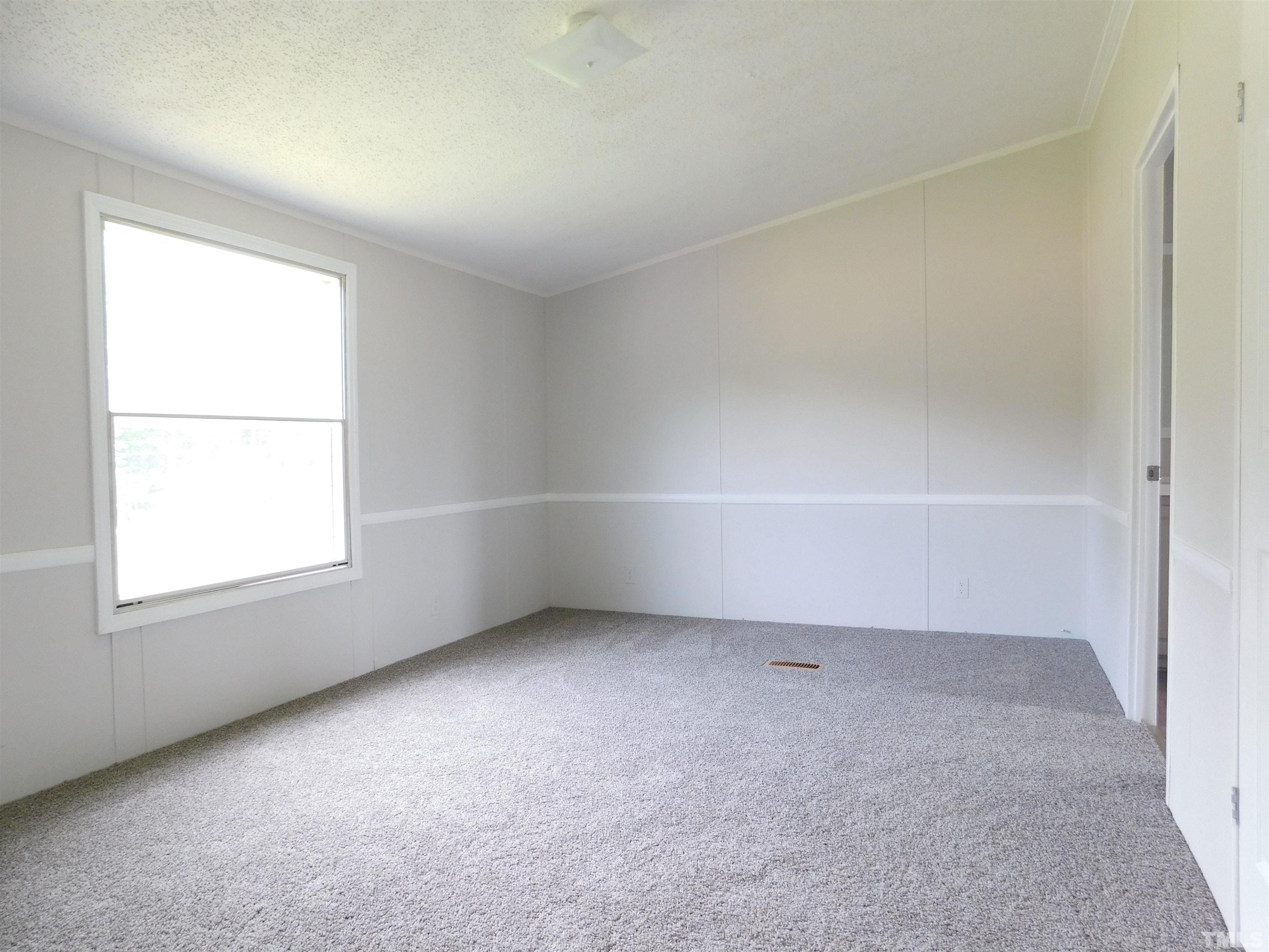 1022 Whitley Road Middlesex, NC 27557 - Photo 10 of 13 an empty room with a window