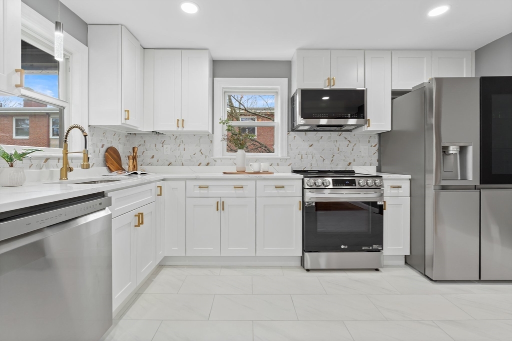 25 Parker Street Newton, MA 02459 - Photo 12 of 38 a kitchen with cabinets stainless steel appliances and a counter space