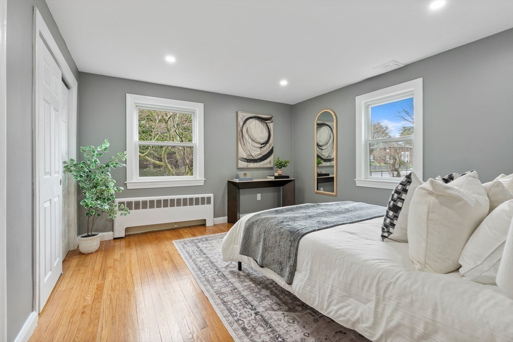 25 Parker Street Newton, MA 02459 - Photo 17 of 38 a bedroom with a bed and a large window