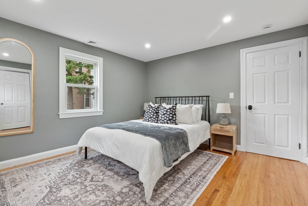 25 Parker Street Newton, MA 02459 - Photo 18 of 38 a bedroom with a bed and a window