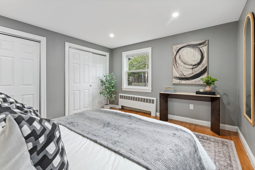 25 Parker Street Newton, MA 02459 - Photo 19 of 38 a bedroom with a bed and a dresser