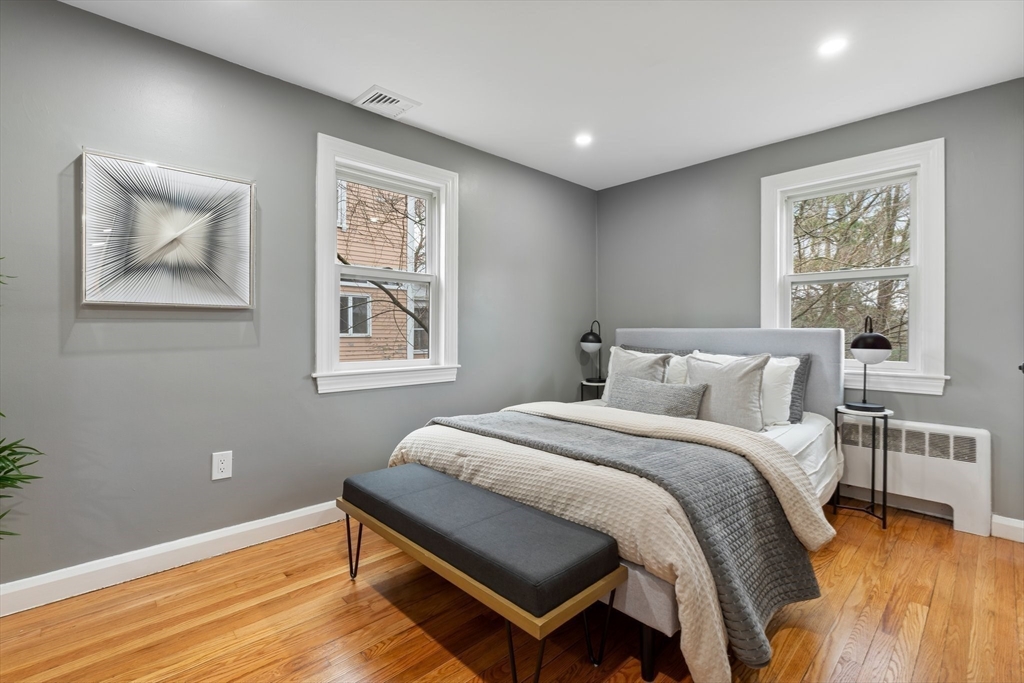 25 Parker Street Newton, MA 02459 - Photo 20 of 38 a bedroom with a bed and a window