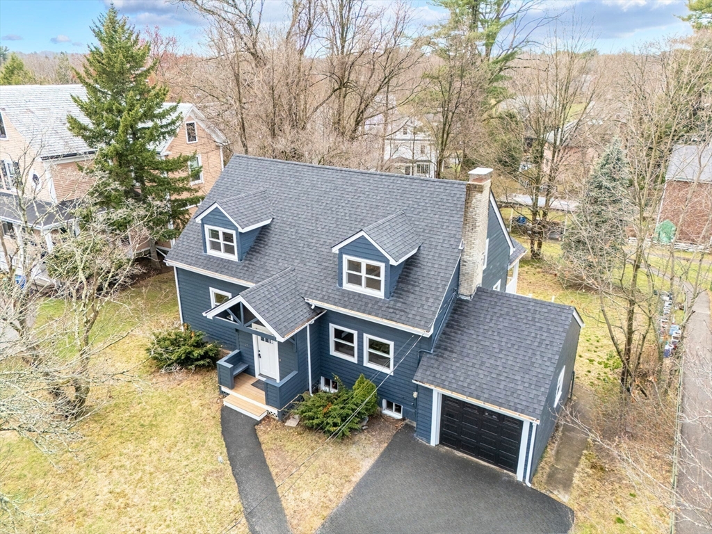 25 Parker Street Newton, MA 02459 - Photo 2 of 38 a front view of a house with a yard