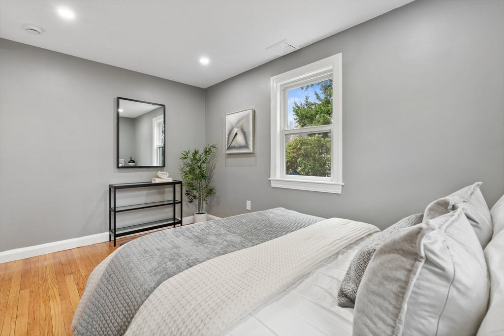 25 Parker Street Newton, MA 02459 - Photo 21 of 38 a bedroom with a bed and a window