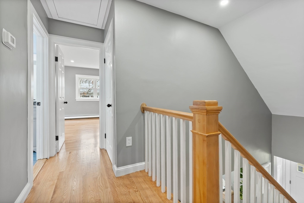 25 Parker Street Newton, MA 02459 - Photo 23 of 38 a view of a hallway with a wooden floor
