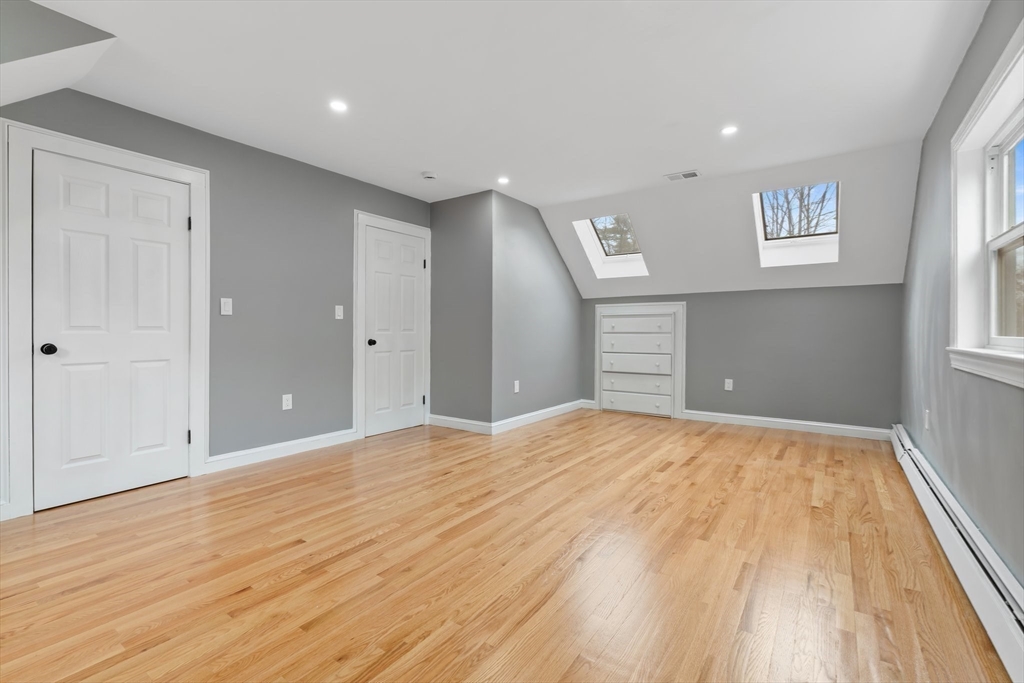 25 Parker Street Newton, MA 02459 - Photo 26 of 38 a big room with wooden floor and windows