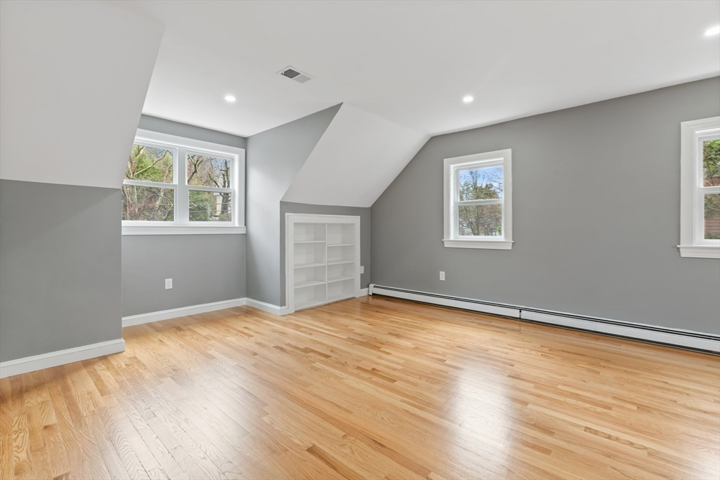 25 Parker Street Newton, MA 02459 - Photo 28 of 38 a view of an empty room with wooden floor and a window