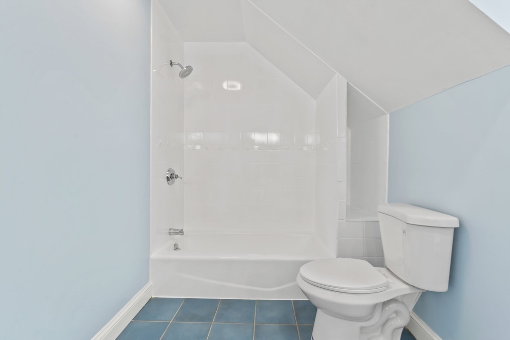 25 Parker Street Newton, MA 02459 - Photo 30 of 38 a bathroom with a toilet and a shower