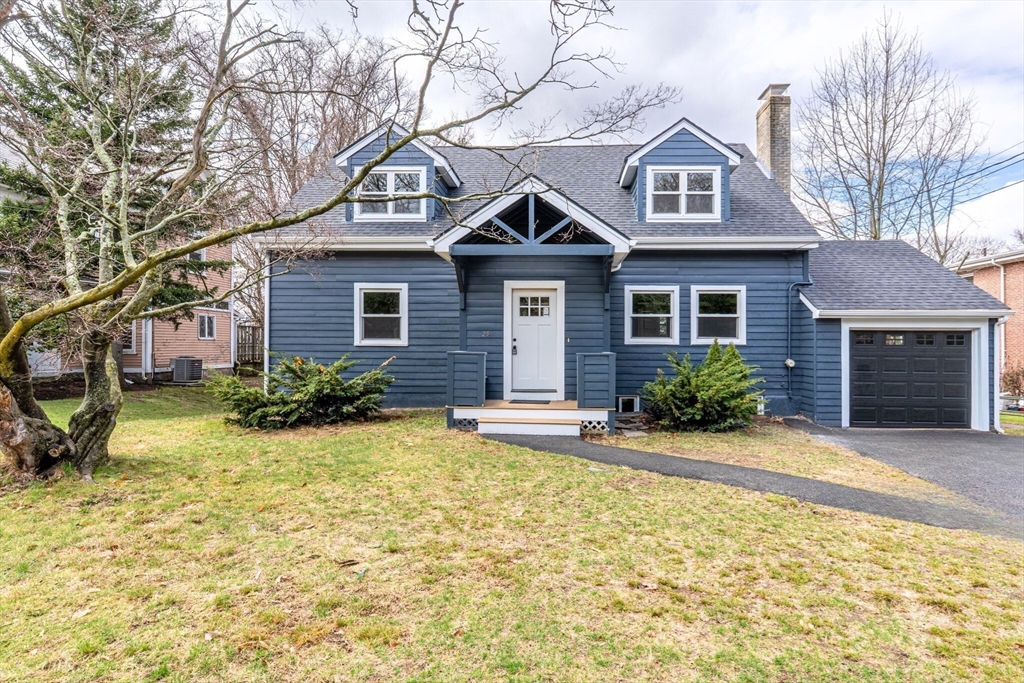 25 Parker Street Newton, MA 02459 - Photo 3 of 38 a front view of a house with a yard and garage