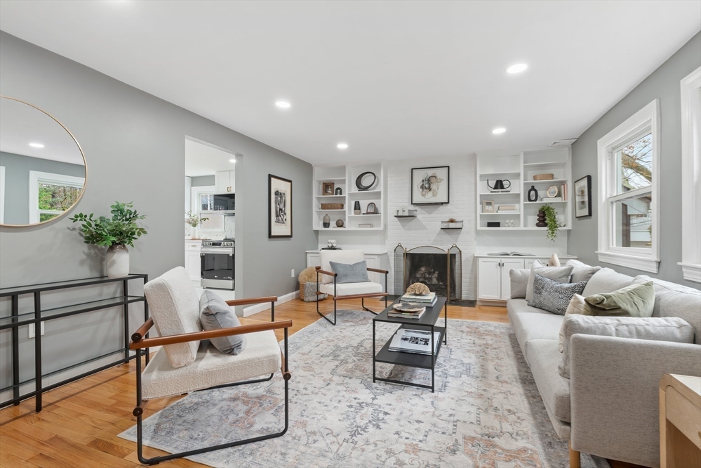 25 Parker Street Newton, MA 02459 - Photo 6 of 38 a living room with furniture a fireplace and a potted plant