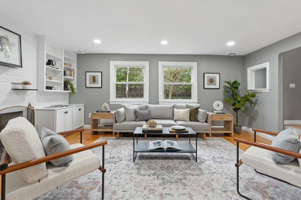 25 Parker Street Newton, MA 02459 - Photo 8 of 38 a living room with furniture potted plant and a window