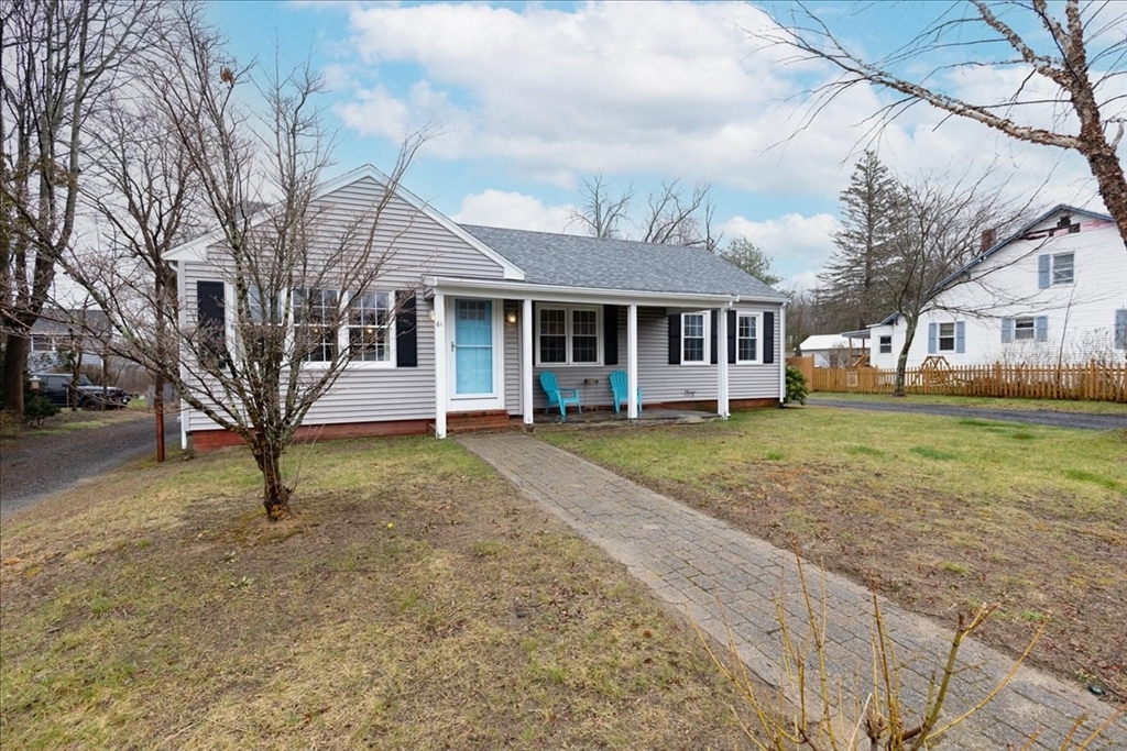 a view of a yard in front of a house