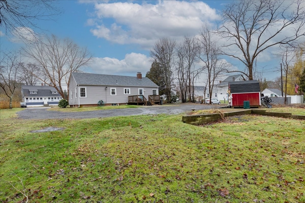 61 Beach Road Salisbury, MA 01952 - Photo 25 of 27 a view of swimming pool with a yard and trees