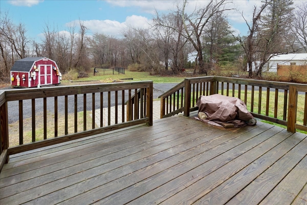 61 Beach Road Salisbury, MA 01952 - Photo 27 of 27 a balcony with wooden floor table and chairs