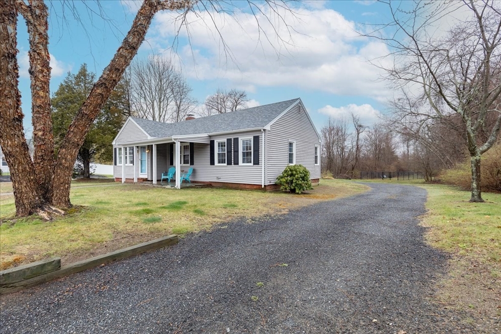 61 Beach Road Salisbury, MA 01952 - Photo 3 of 27 a front view of a house with garden