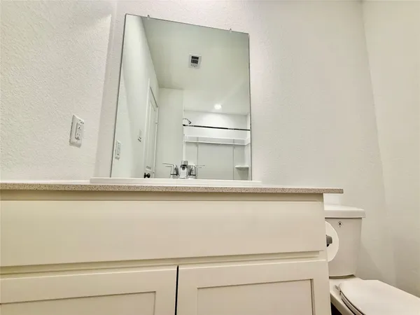 a close view of bathroom sink toilet and tub