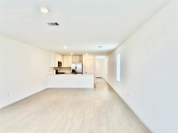 a view of kitchen and kitchen with sink