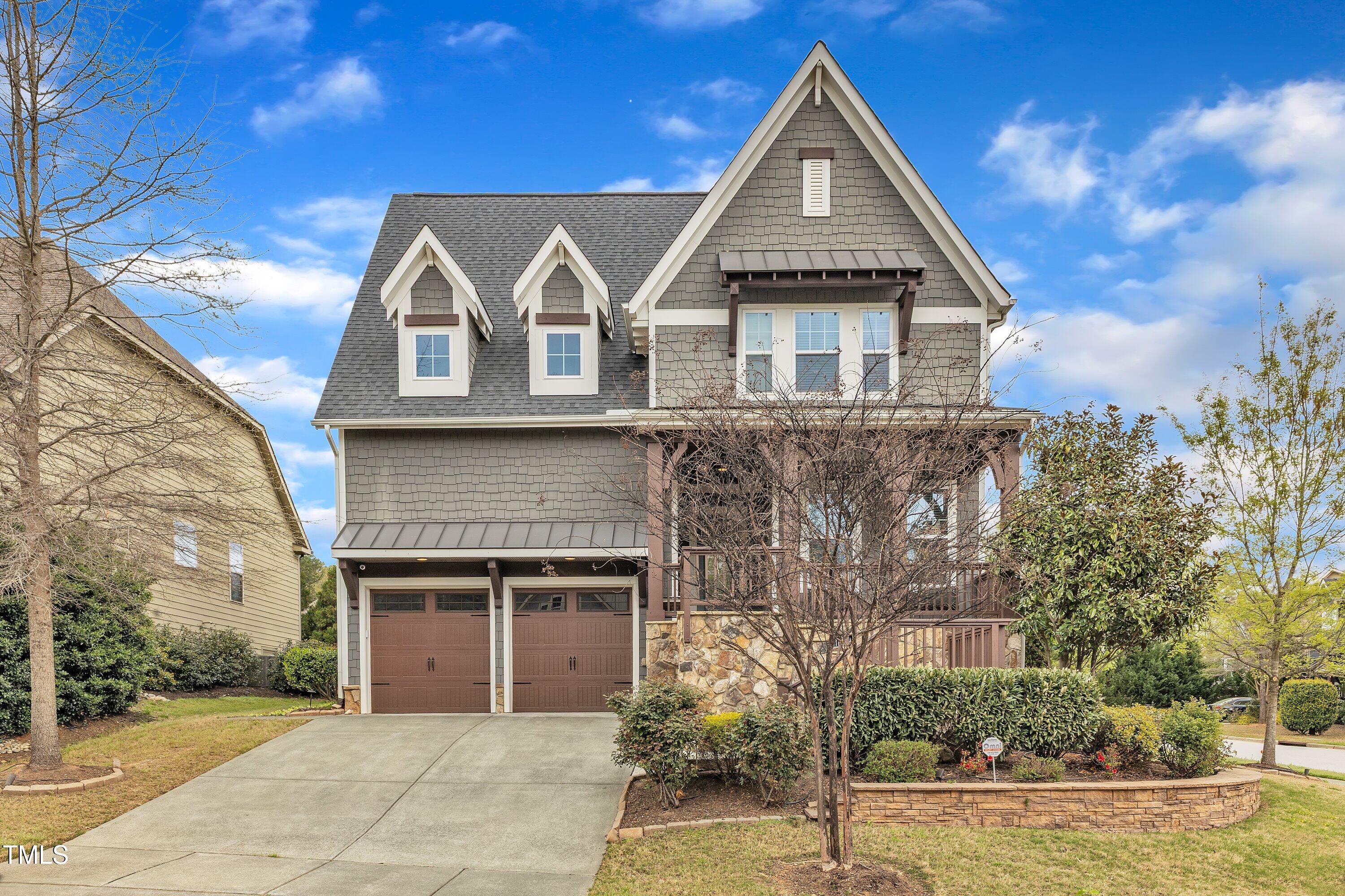 8121 Greys Landing Way Raleigh, NC 27615 - Photo 8 of 95 a front view of a house with a yard