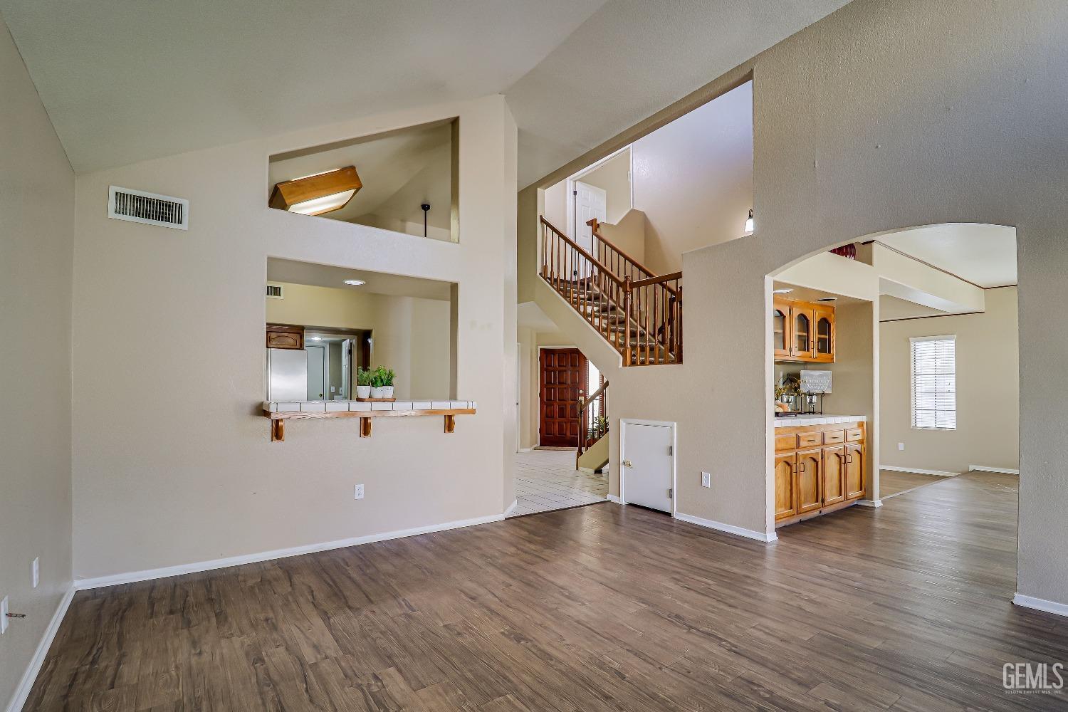 Undisclosed Address Bakersfield, CA 93311 - Photo 14 of 51 wooden floor in an empty room with a window
