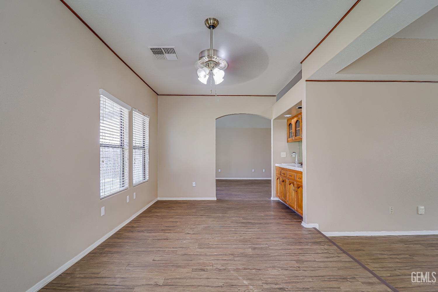 Undisclosed Address Bakersfield, CA 93311 - Photo 20 of 51 wooden floor in an empty room with a window
