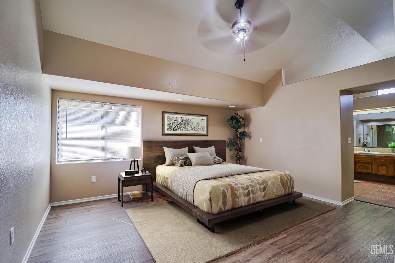 Undisclosed Address Bakersfield, CA 93311 - Photo 28 of 51 a bedroom with a bed and a window