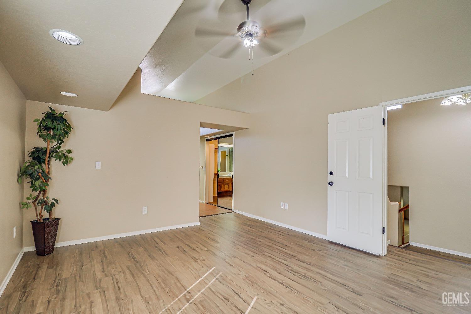 Undisclosed Address Bakersfield, CA 93311 - Photo 30 of 51 wooden floor in an empty room with a window