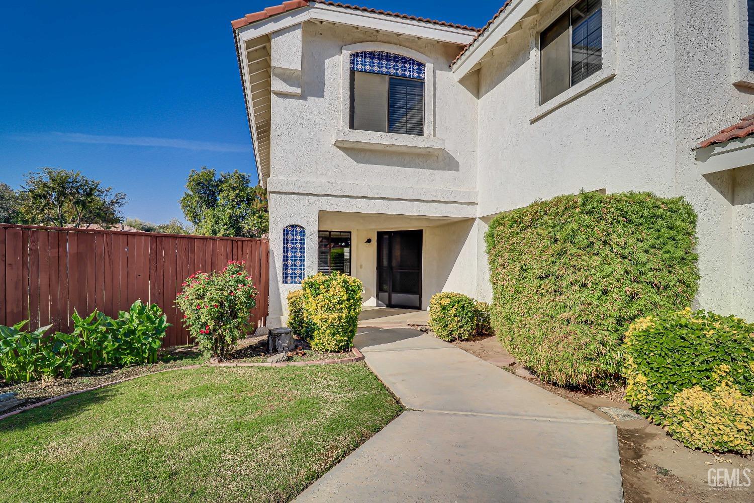 Undisclosed Address Bakersfield, CA 93311 - Photo 3 of 51 a front view of a house with garden