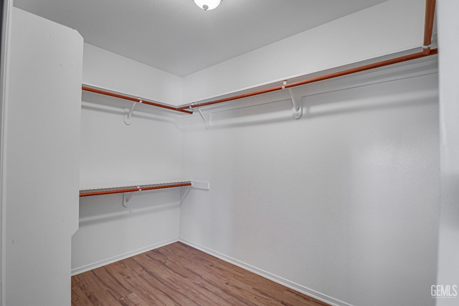 Undisclosed Address Bakersfield, CA 93311 - Photo 34 of 51 a view of an empty walk in closet
