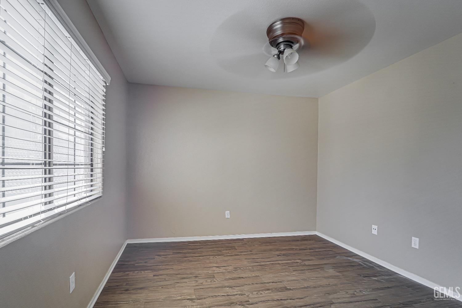 Undisclosed Address Bakersfield, CA 93311 - Photo 37 of 51 a view of a livingroom with a window and wooden floor