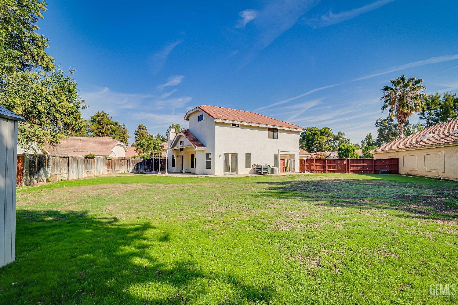 Undisclosed Address Bakersfield, CA 93311 - Photo 41 of 51 a front view of a house with a garden