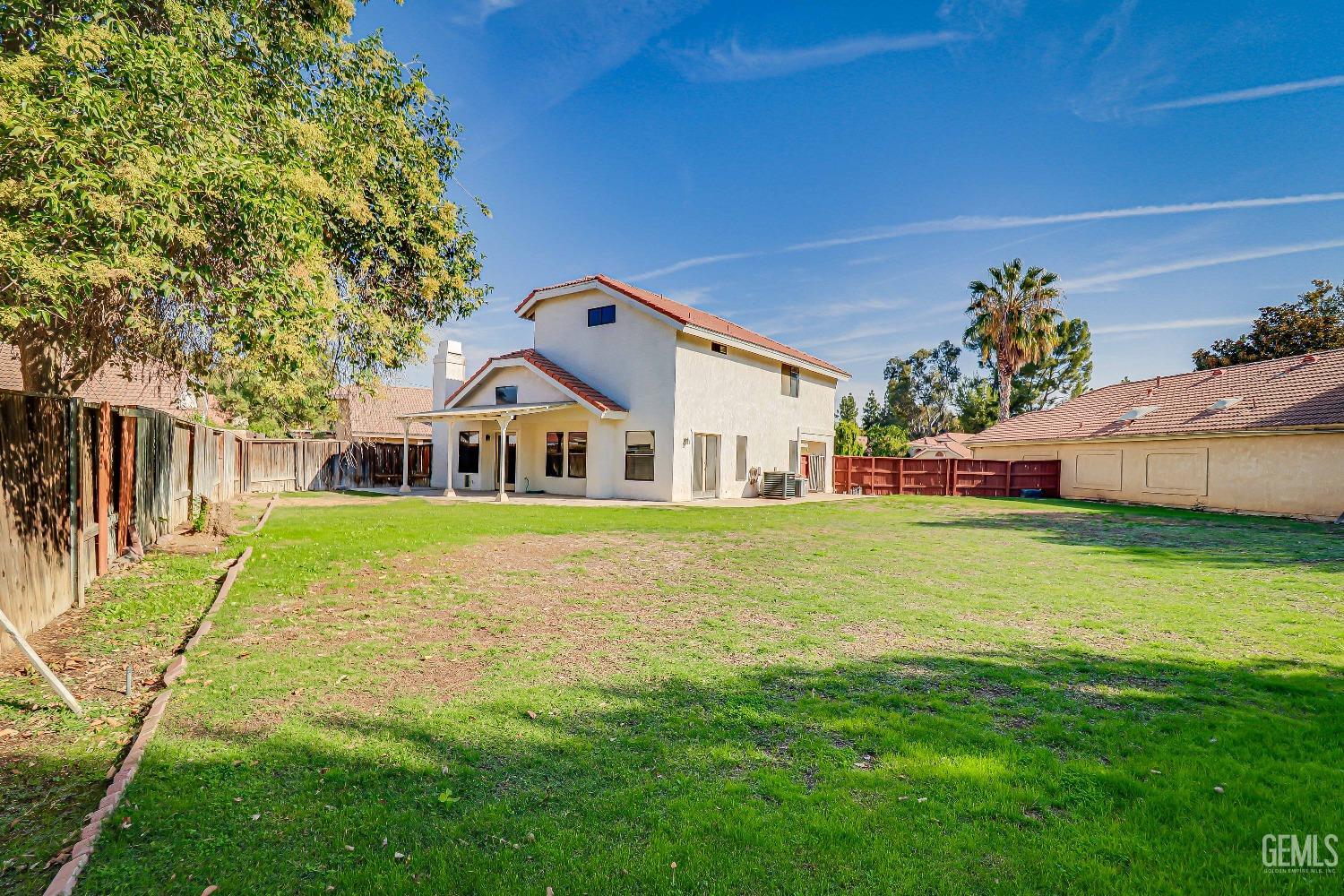 Undisclosed Address Bakersfield, CA 93311 - Photo 42 of 51 a front view of a house with a yard table and chairs