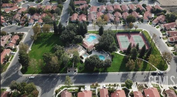 Undisclosed Address Bakersfield, CA 93311 - Photo 50 of 51 an aerial view of a house with a yard and a large tree