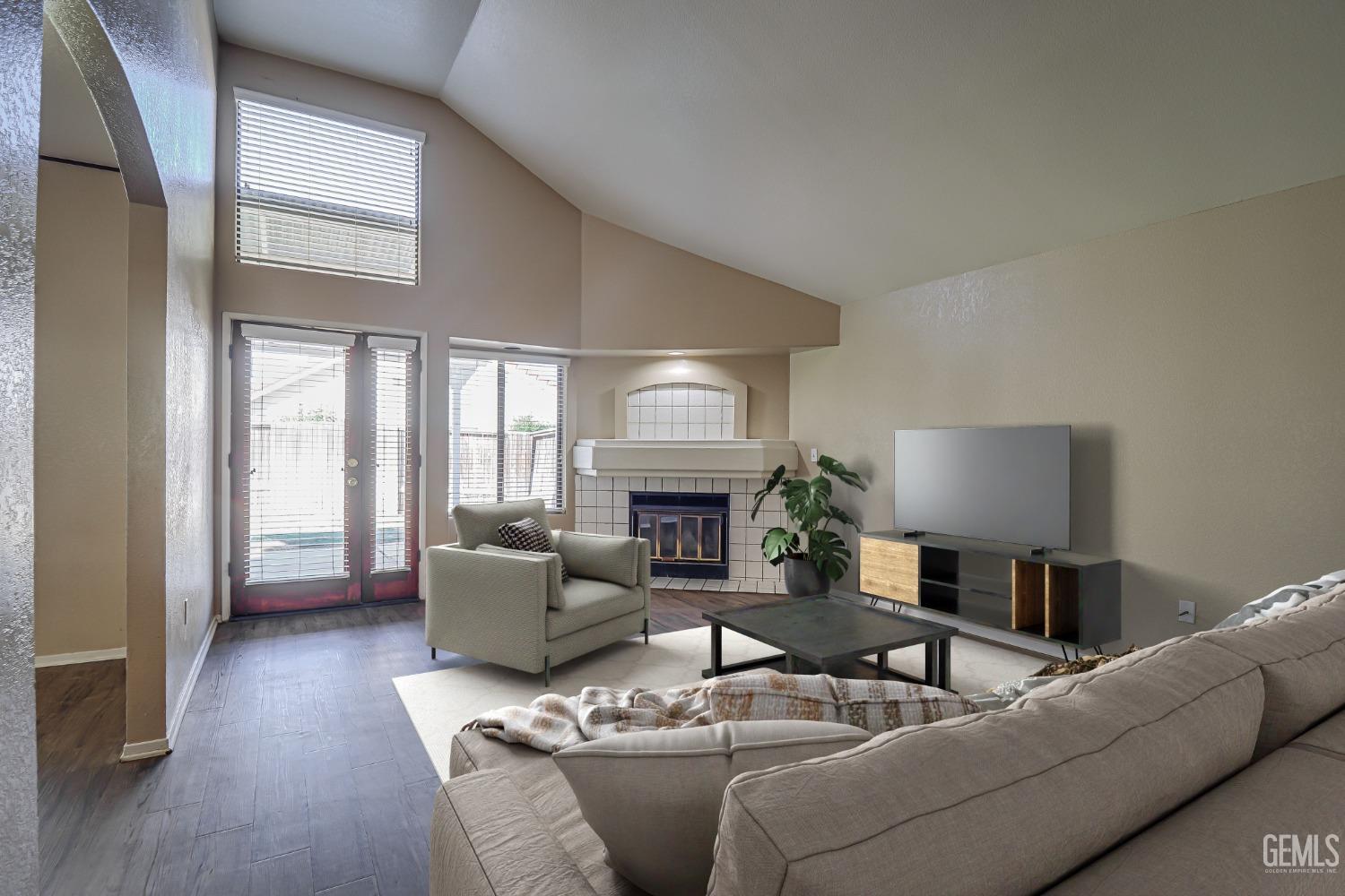 Undisclosed Address Bakersfield, CA 93311 - Photo 5 of 51 a living room with furniture and a fireplace