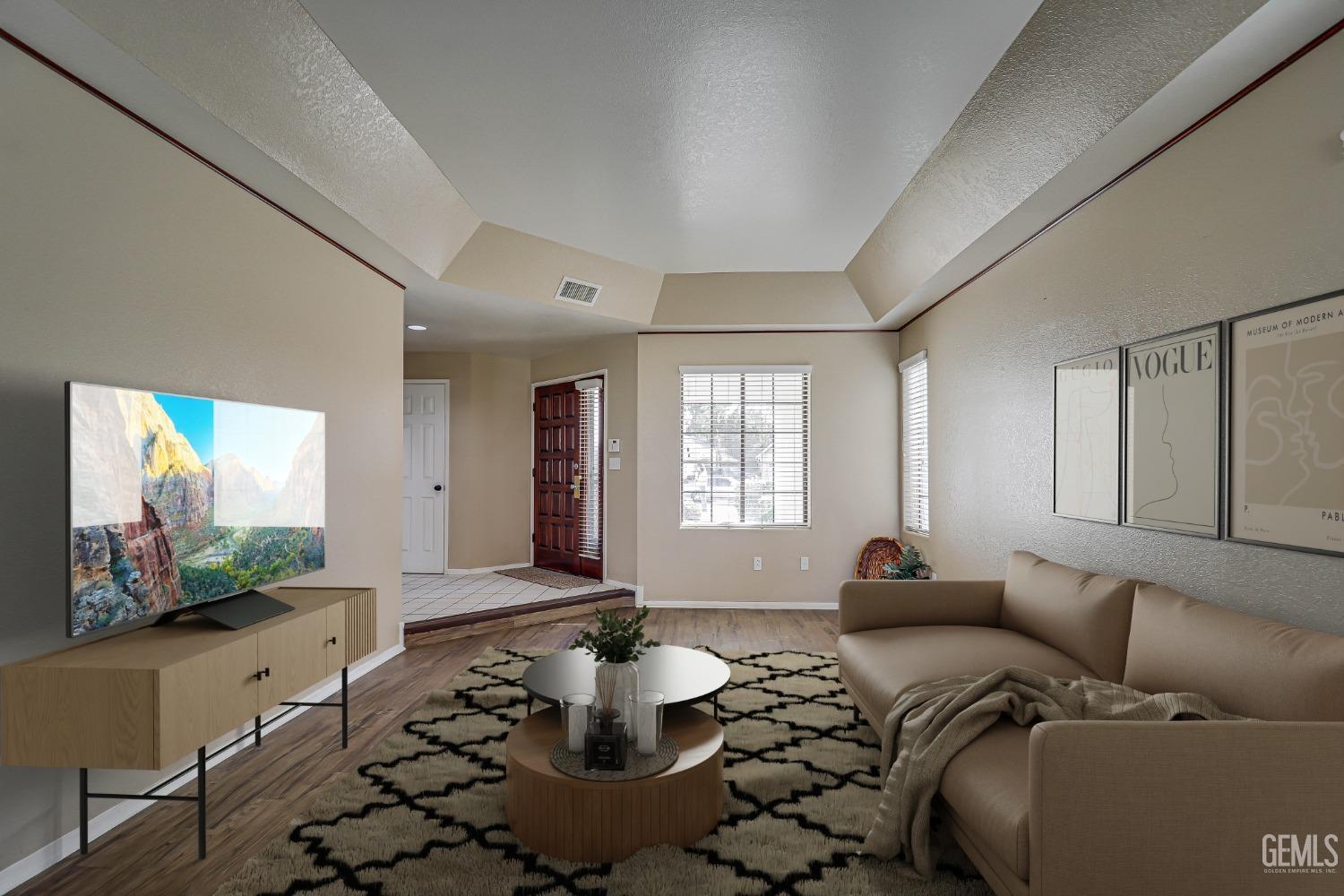 Undisclosed Address Bakersfield, CA 93311 - Photo 9 of 51 a living room with furniture and a flat screen tv