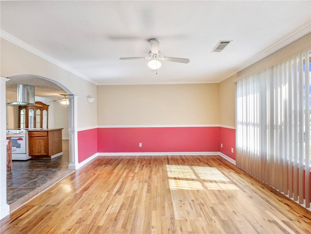 1686 Shoal Creek Road Monroe, GA 30656 - Photo 3 of 50 a view of empty room with wooden floor and fan