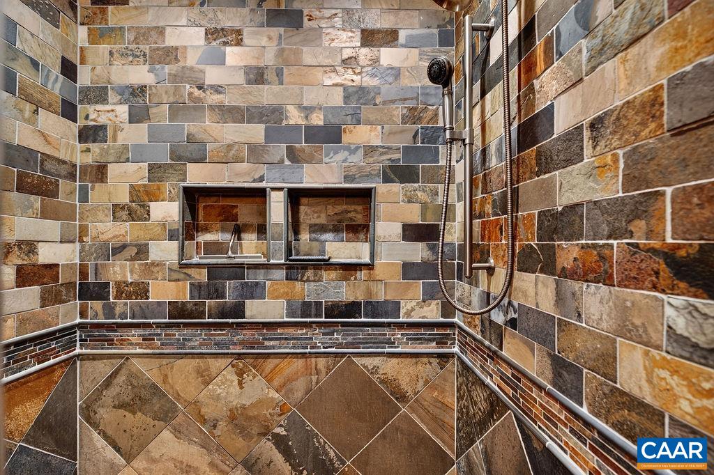 1300 Blue Ridge Drive Roseland, VA 22967 - Photo 34 of 48 Stunning tiled shower in the primary bathroom.